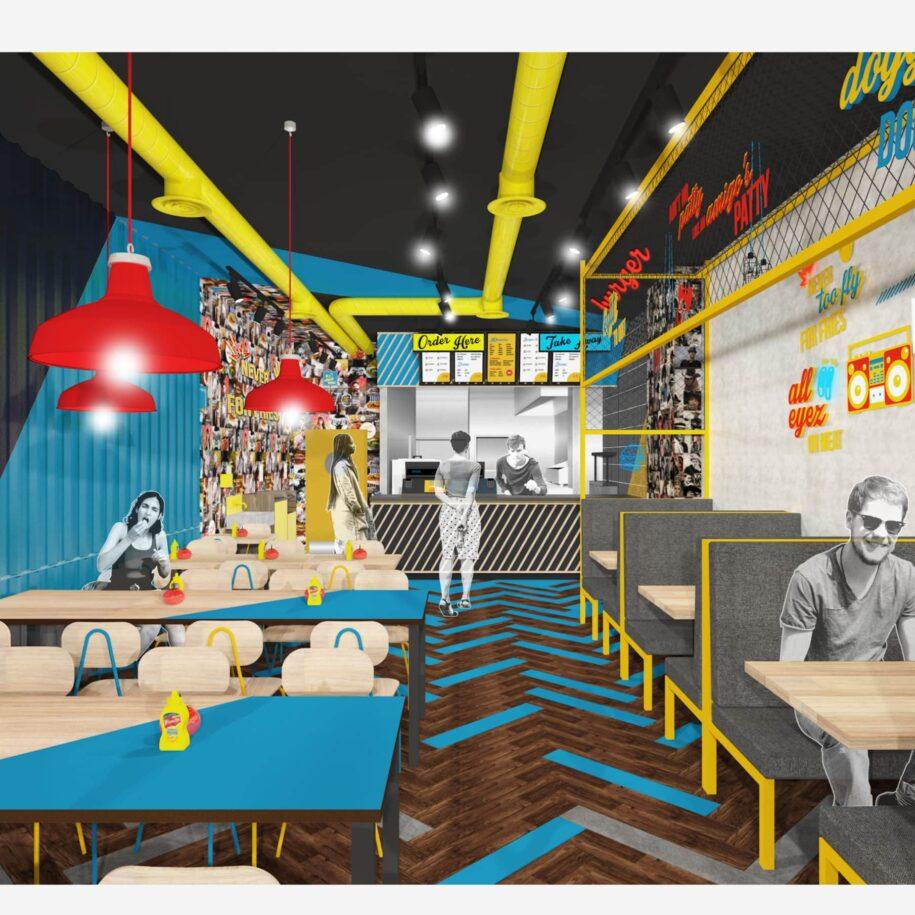 A modern burger restaurant interior featuring colorful decor with red pendant lights, a vibrant blue wall, and a mural of photographs. Dining tables with mustard bottles are arranged throughout, alongside gray booths. An ordering counter with a menu is visible, and patrons are seen in the space.